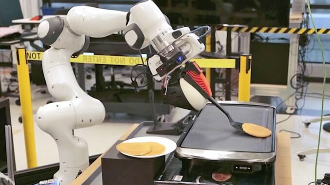 Robot gira frittella su piastra