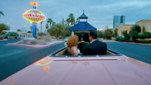 Video The hardest part - Protagonisti di spalle in auto su strada con logo iconico di Las Vegas 