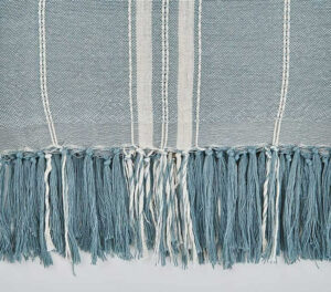 Plaid morbido a trama larga realizzato interamente con bottiglie riciclate